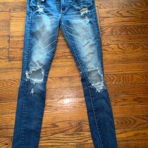 Buckle Blue Skinny Jeans with Distressed Details